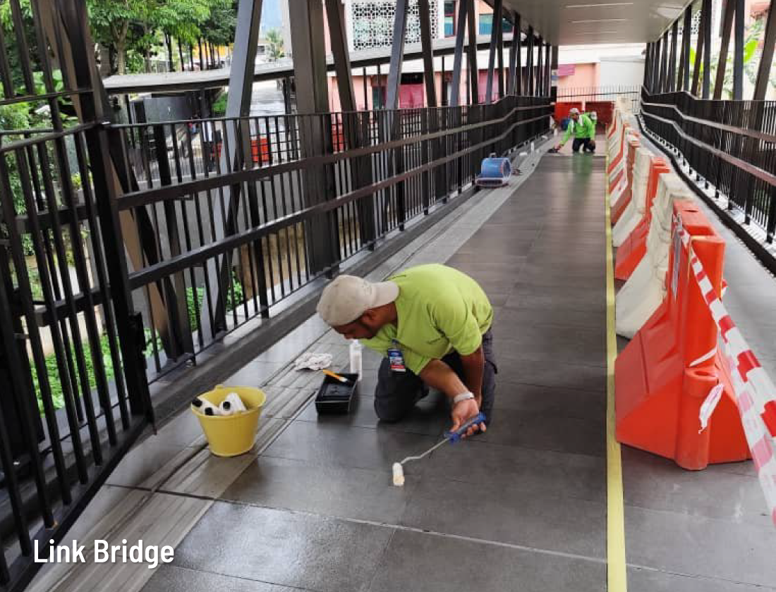 Durable non-toxic anti slip floor coating applied to a commercial link bridge to reduce slip hazards